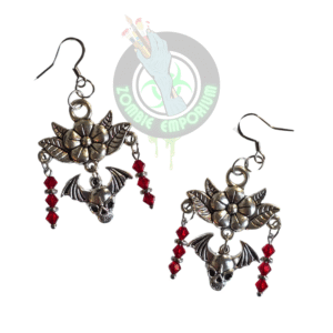 Handmade flower chandelier earrings with skull and bat charms, red crystal beads, and stainless steel findings displayed on a white background.
